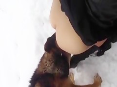 Playing in the snow with dog